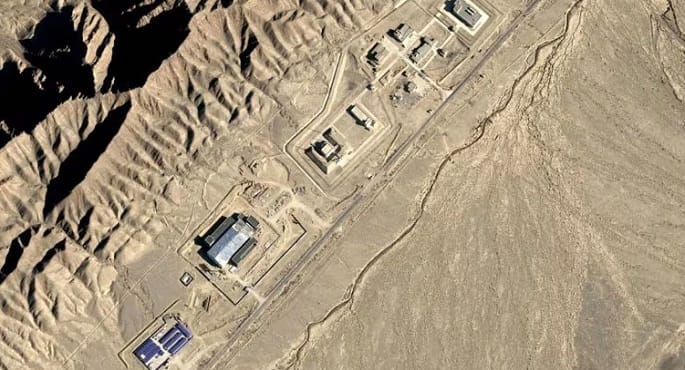 صورة رمزية لمنشأة نووية أو خريطة عالمية تظهر الصين.